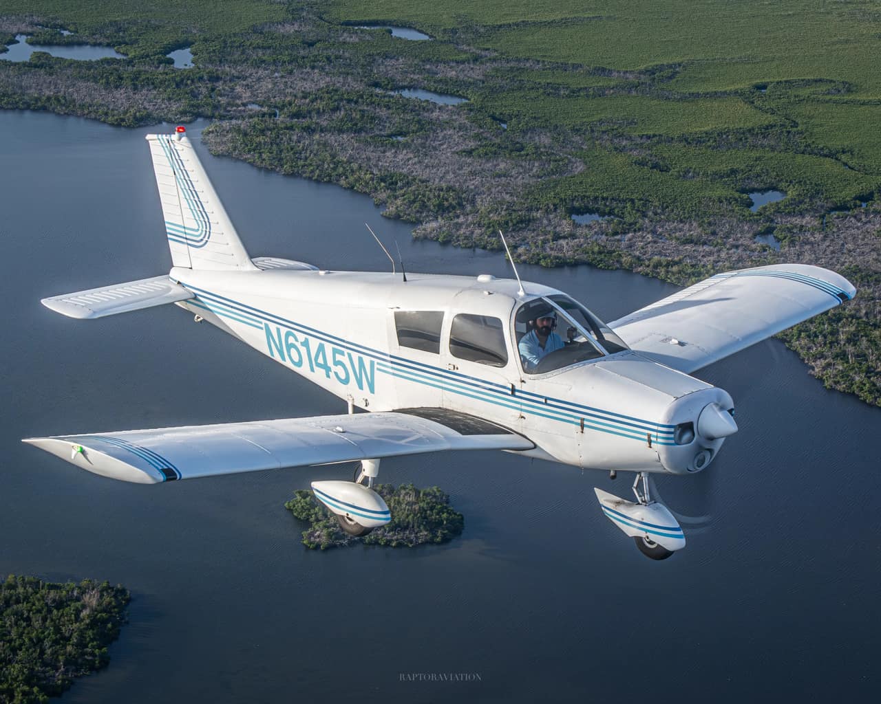 Core Aviator Training’s Piper Cherokee 140 N6145W in flight over Southwest Florida